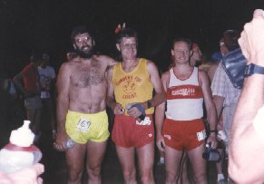 3 men smile at camera before running, picture from a film camera